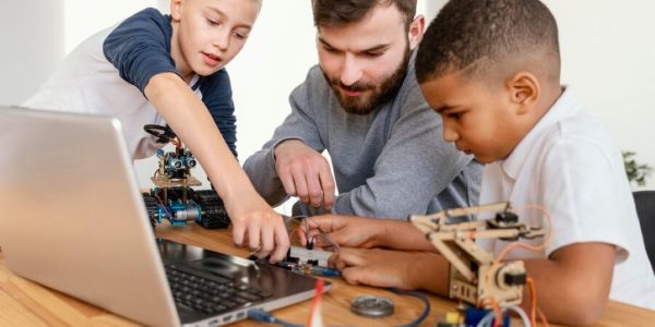 Father and sons making Robot